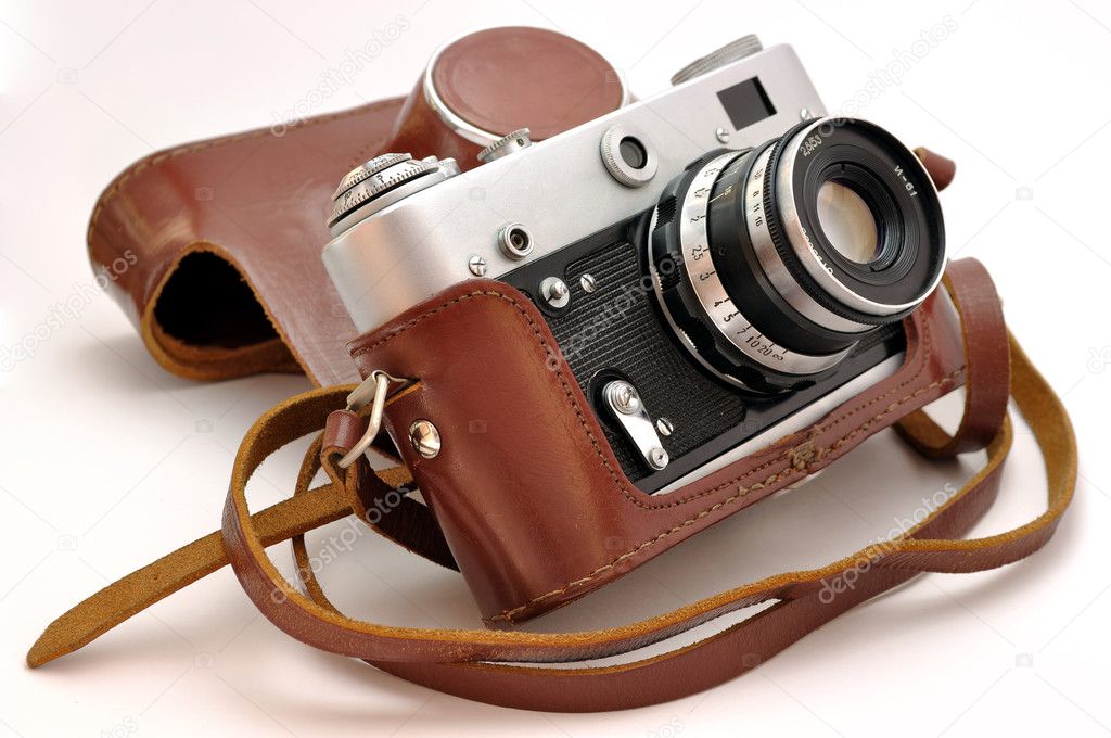 Used old-fashioned film photo-camera in leather case