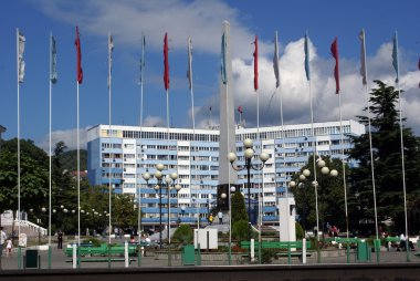 Long building and flags clipart