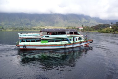 Ferry on the lakr Toba clipart