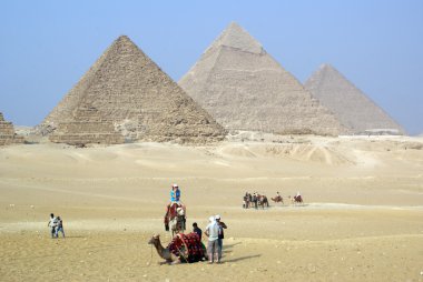 Tourists and piramids clipart