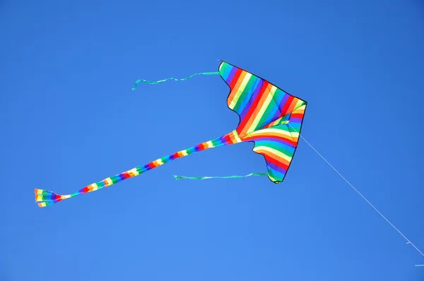 Stripy kite at the sky — Stock Photo, Image