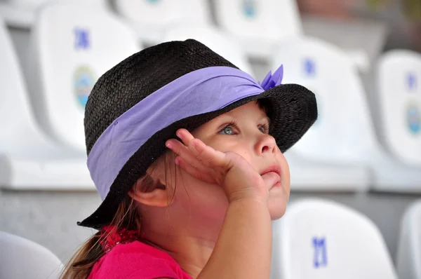 Little girl watching performance — Stock Photo, Image