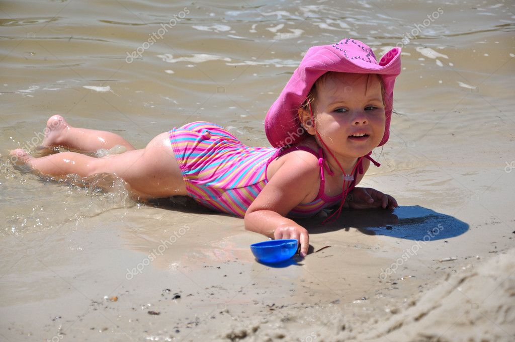 Pretty Little Girl Lying On Sandy Beach Stock Photo Image By C Kyrychenko