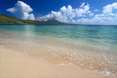 Secluded beach on Saint Kitts clipart