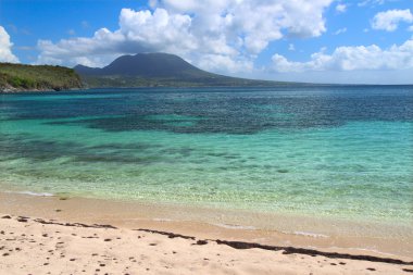 Tranquil beach on Saint Kitts clipart