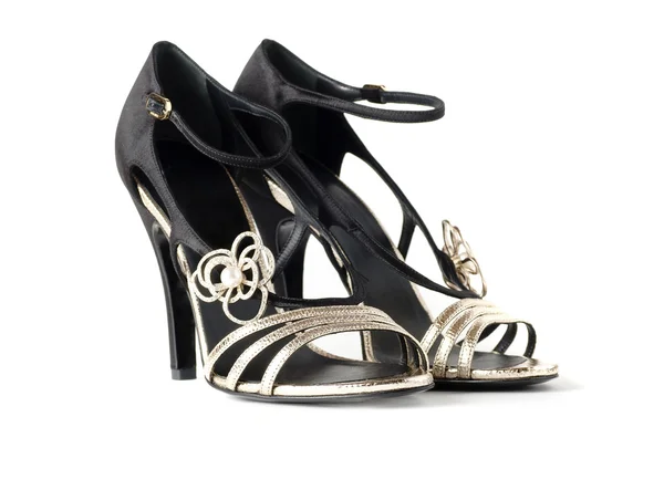 Černé a zlaté dámské sandály — Stock fotografie