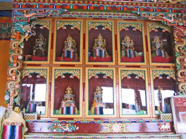 Ladakh, India, Shey, the Buddha behind glass in a monastery. clipart