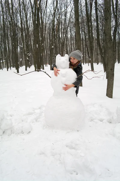 Girl Embraces Big Snowman Park Winter Moscow Russia — Stock Photo, Image
