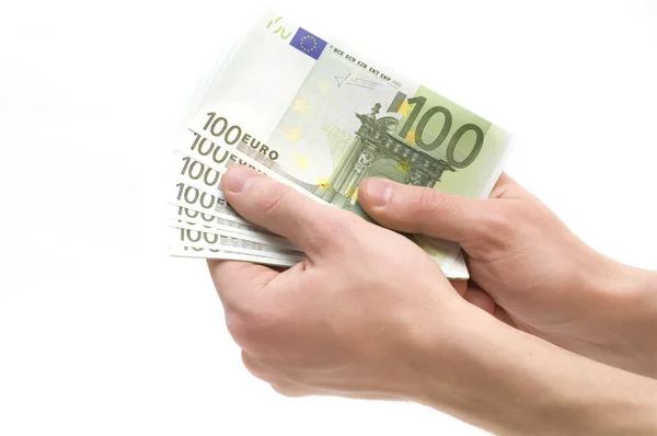 Мужские руки с деньгами на белом фоне — стоковое фото
