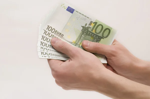 stock image Male hands with money on white background