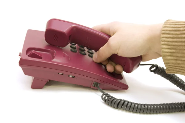Männliche Hand greift zum Telefon auf weißem Hintergrund — Stockfoto