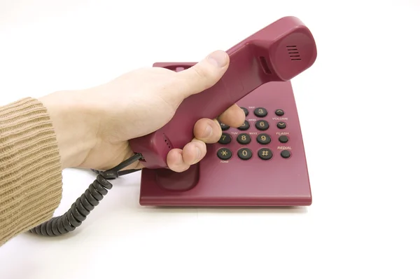 Männliche Hand greift zum Telefon auf weißem Hintergrund — Stockfoto