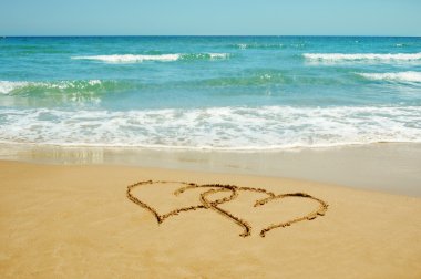 Hearts in the sand clipart