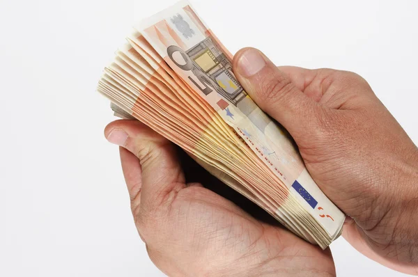 Alguien contando billetes de euro — Foto de Stock