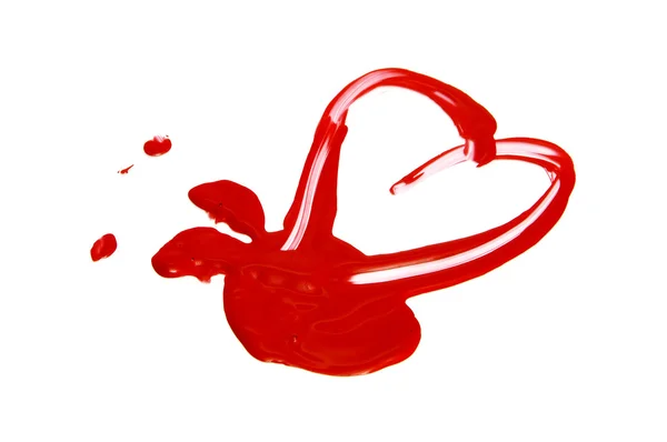 Een hart op een witte achtergrond met rode verf getekend — Stockfoto