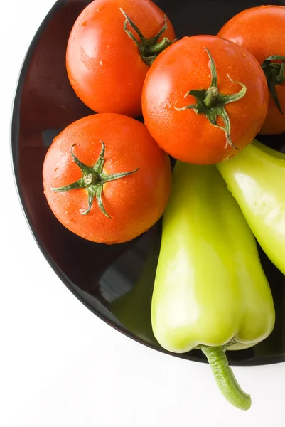 Tomaatit ja paprikat — kuvapankkivalokuva