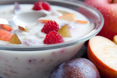 Yogurt mixed with fruit pieces clipart