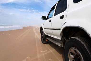 Car on the beach clipart