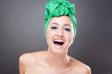 Happy smiling woman with green scarf on head clipart