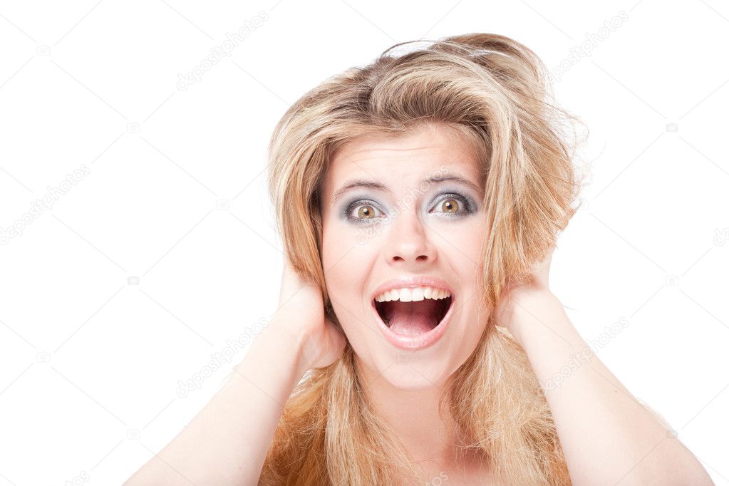 Surprised shouting blonde woman holding head with hands