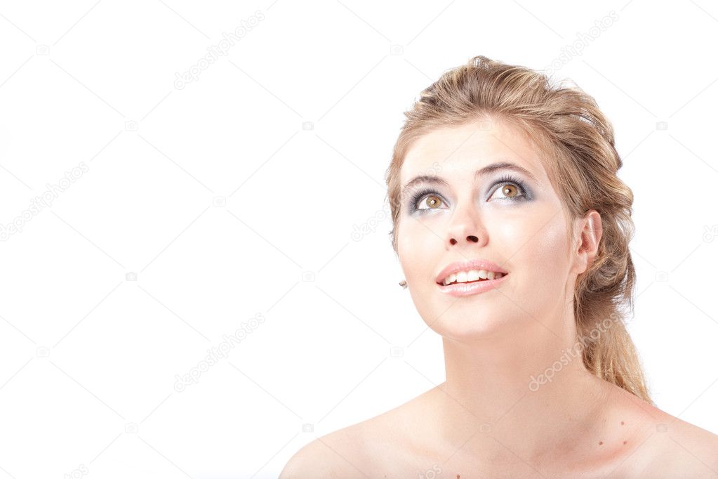 Beautiful dreamy young woman with large grey eyes looking up