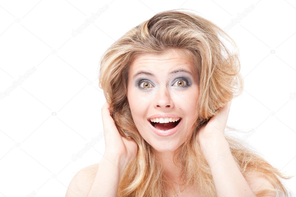 Surprised shouting blonde woman holding head with hands