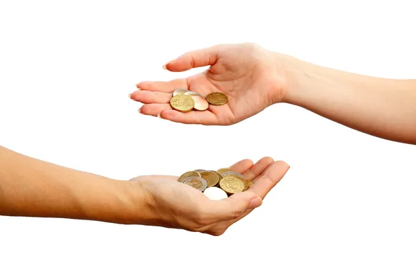 Female hand pours down coins into hand of another person — Stock Photo, Image