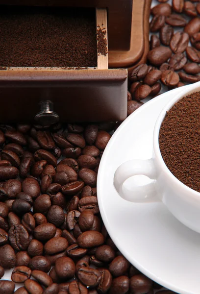 stock image Fragment of a cup with ground coffee and coffee beens