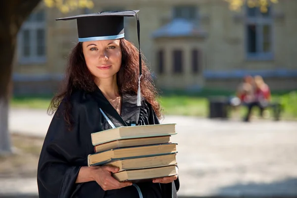 The graduate with books — Stock Photo, Image