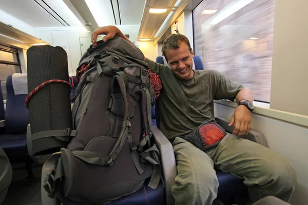 stock image Young male traveler on fast moving intercity train