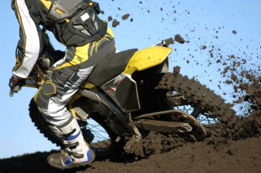 Motocross rider during a race. clipart