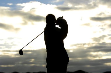 golfer silhouette at morning light clipart