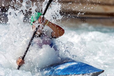 male kayaker races down  clipart