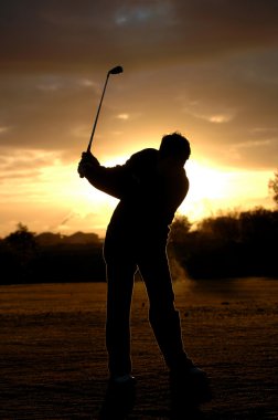 golfer silhouette at morning light clipart