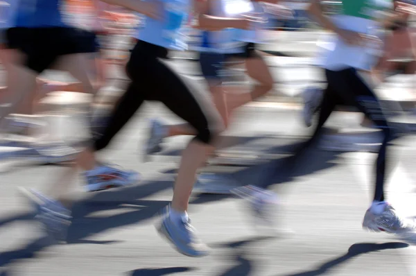Marathonläufer in Aktion lizenzfreie Stockbilder