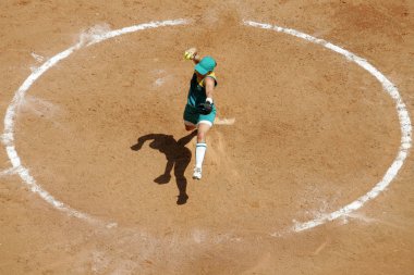 female softball player pitches ball  clipart