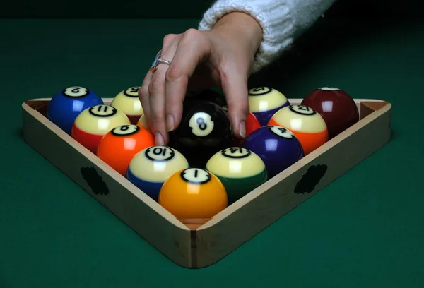 Hand with Balls on pool table — Stock Photo, Image