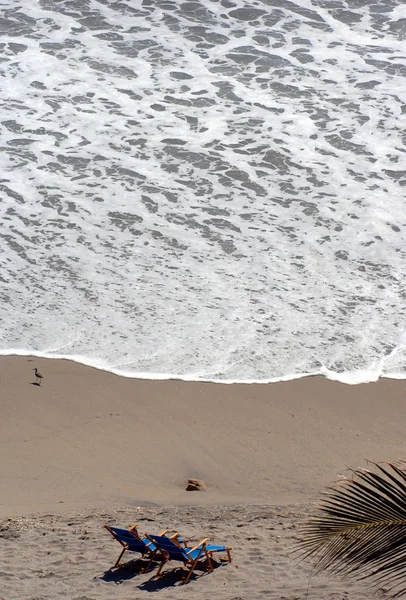 Beach chairs on sand — Stock Photo, Image