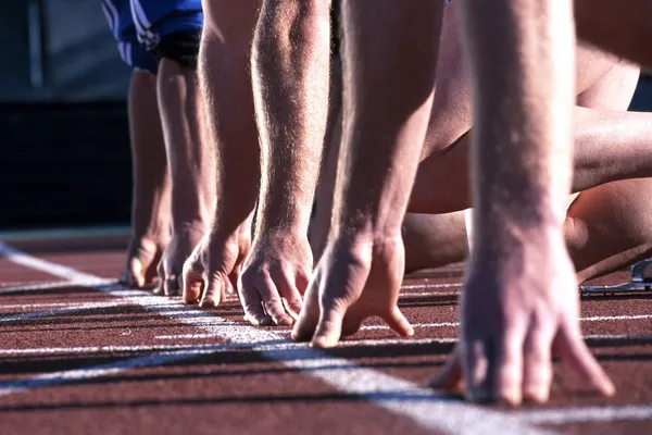 Athlete  hands at start line — Stock Photo, Image