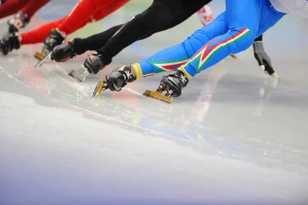 Ice-skaters runners legs — Stock Photo, Image