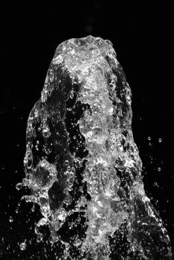 Water jet on black background clipart