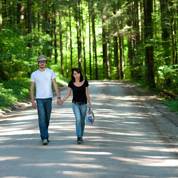 Young couple in forest — Stock Photo, Image