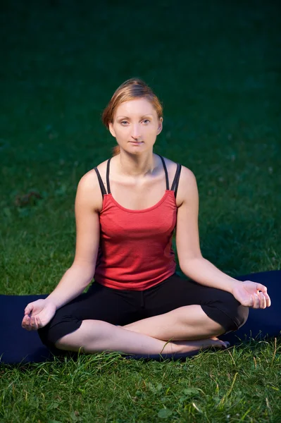 Cute girl meditates in nature Royalty Free Stock Images
