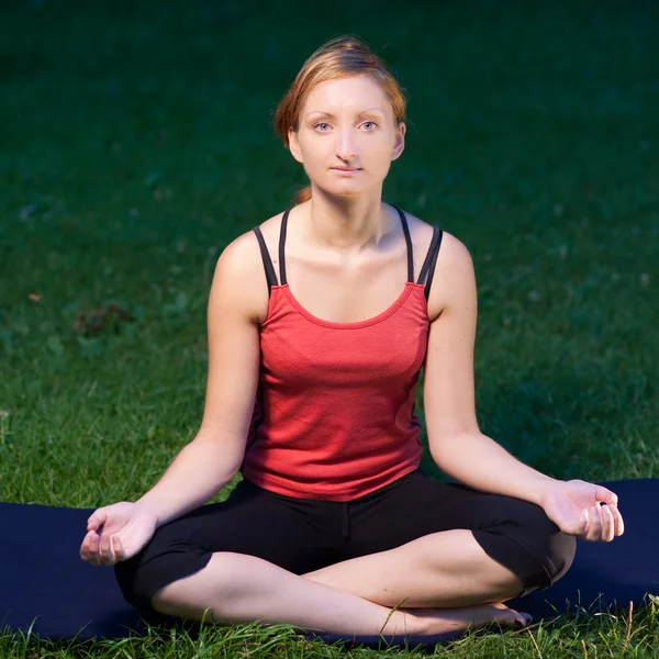 Cute girl meditates in nature Royalty Free Stock Photos