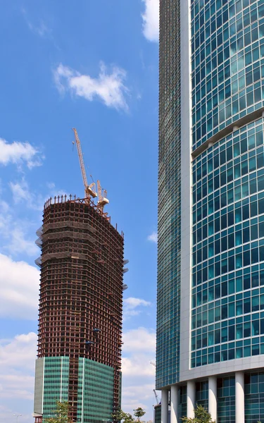 stock image New skyscrapers business centre, climbers clean windows