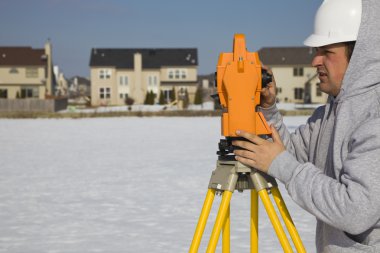 Land surveying during the winter clipart