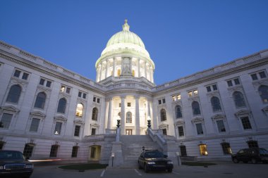 Police cars in front of State Capitol clipart