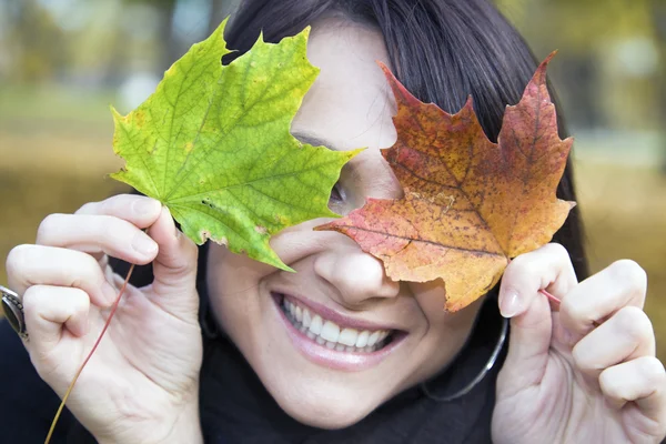 Stock image Pretty smile and colorful leaves