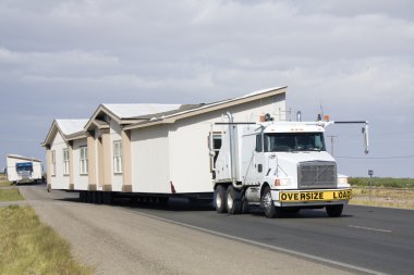 Transporting portable homes clipart