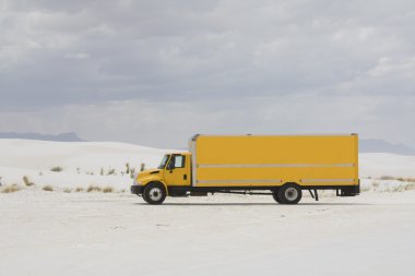 Yellow truck in White Sand Dunes NM clipart